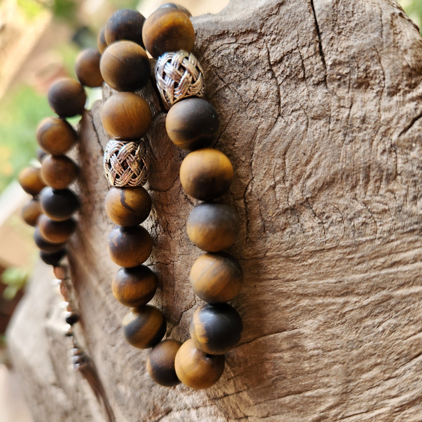 Wooden like beaded misbaha with tassel on a wooden surface