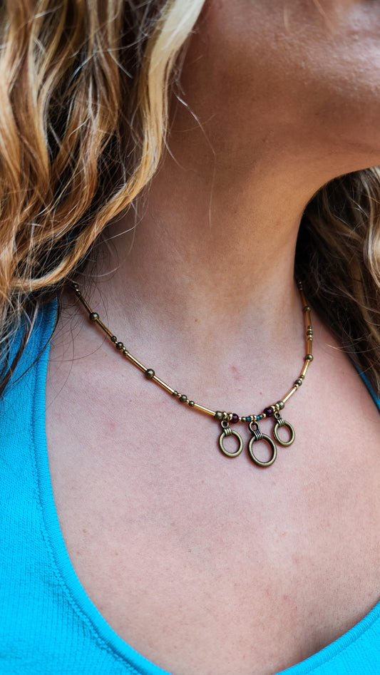 Bronze Necklace with Garnet Stones, Turquoise Beads and Gold-Plated Spacers