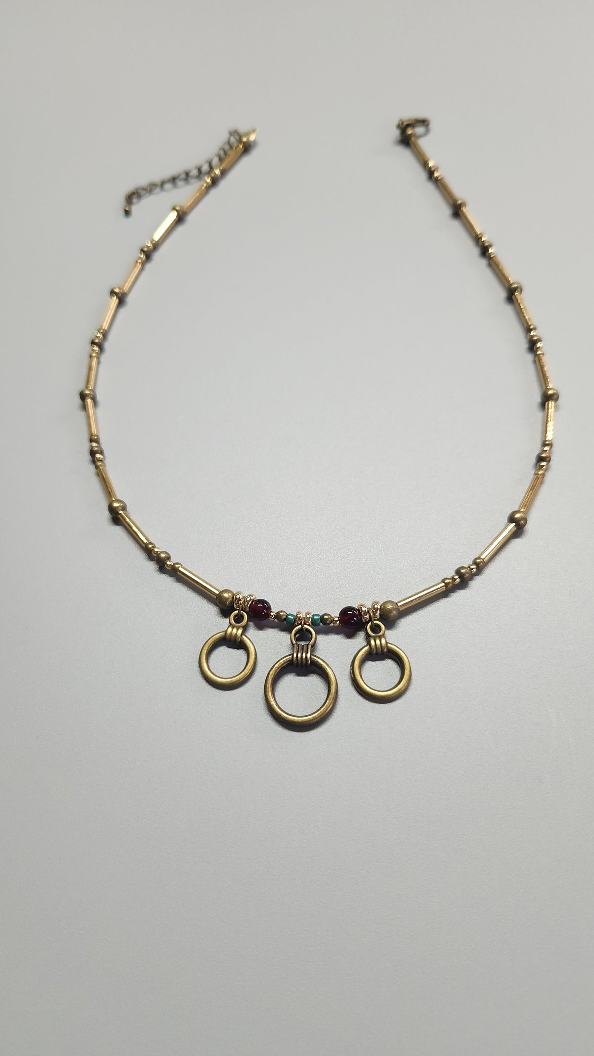 Bronze Necklace with Garnet Stones, Turquoise Beads and Gold-Plated Spacers