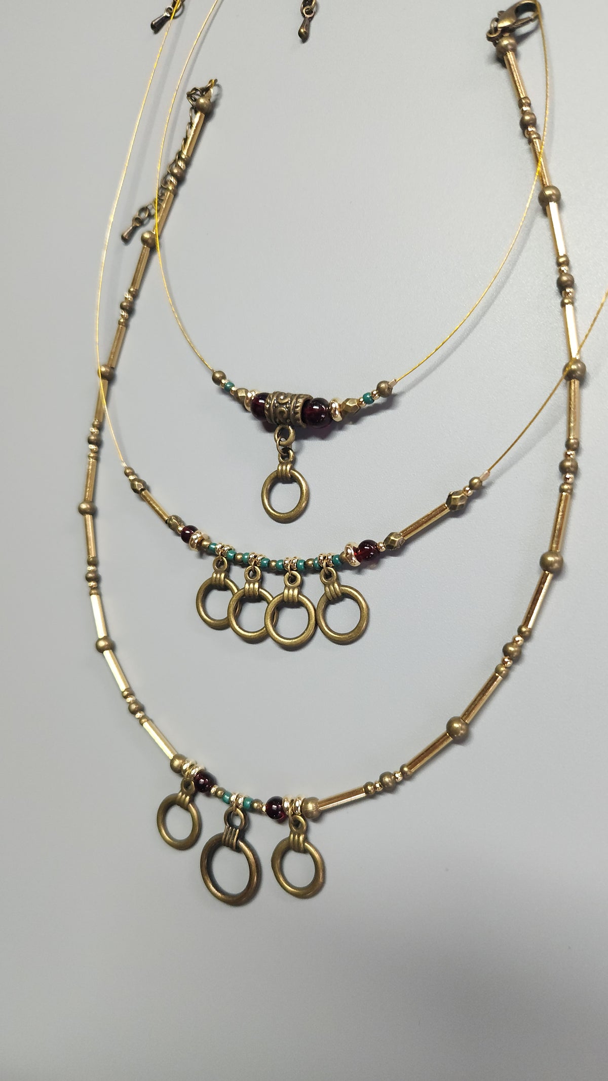 Bronze Necklace with Garnet Stones, Turquoise Beads and Gold-Plated Spacers