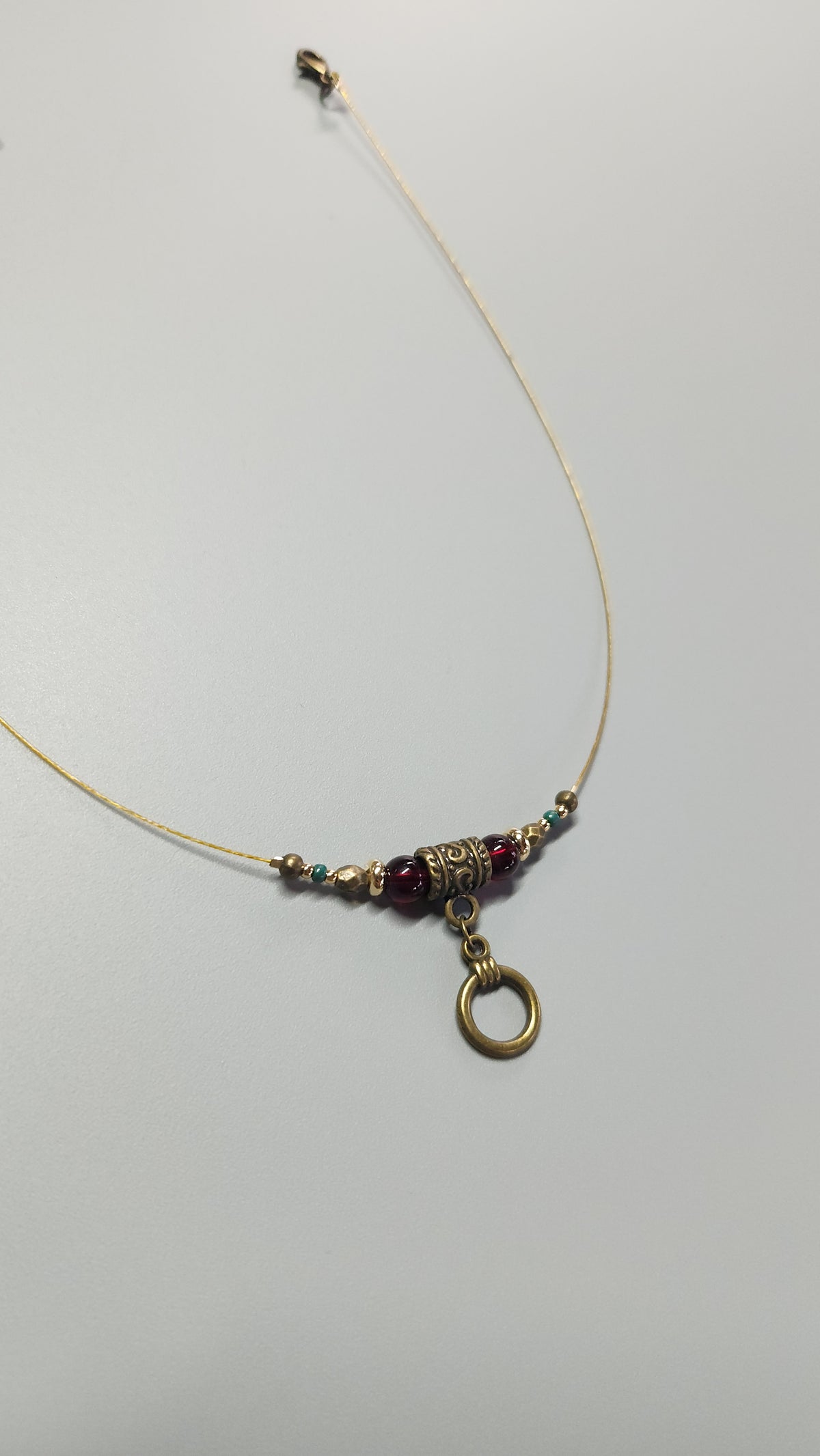 Bronze Necklace with Garnet Stones, Turquoise Beads and Gold-Plated Spacers